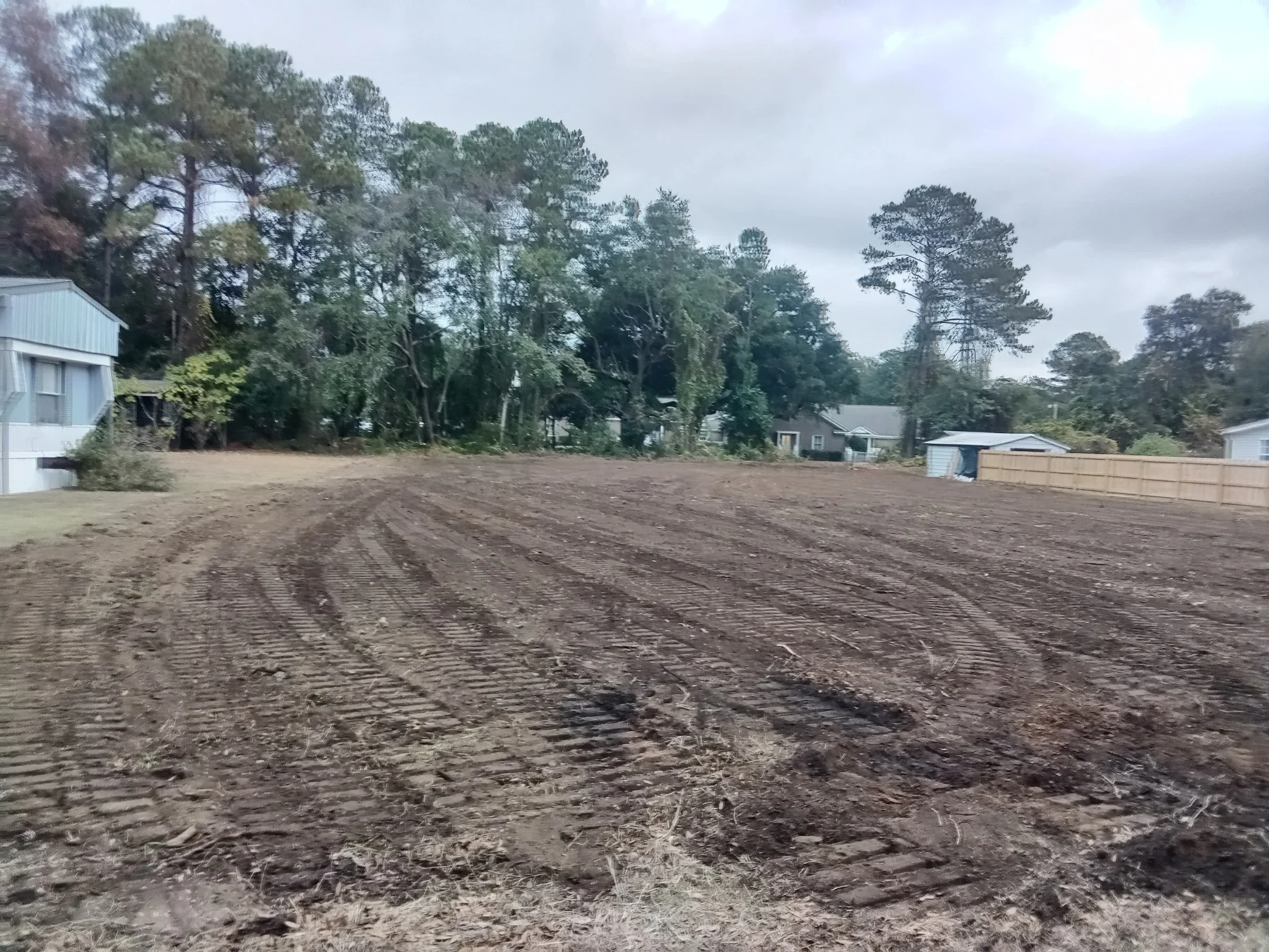 A wider view across a cleared and graded lot.